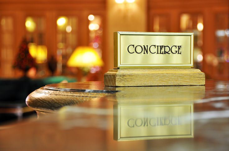 Interior view of a luxury hotel lobby with concierge security in Dubai.